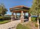 Scenic gazebo overlooking a serene lake, providing a peaceful retreat for residents at 5853 Semolino St, Nokomis, FL 34275