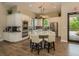 Modern kitchen with stainless steel appliances, a center island, and plenty of cabinet space at 5853 Semolino St, Nokomis, FL 34275