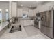 Modern kitchen with granite countertops, stainless steel appliances, and ample cabinet space at 5853 Semolino St, Nokomis, FL 34275