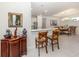 View of kitchen and dining room from the breakfast bar at 5853 Semolino St, Nokomis, FL 34275