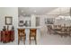 View of kitchen and dining room from the breakfast bar at 5853 Semolino St, Nokomis, FL 34275