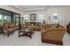 Cozy living room with comfortable sofas, decorative pillows, and elegant furnishings at 5853 Semolino St, Nokomis, FL 34275