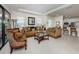 Inviting living room with cozy sofas, decorative accents, and bright lighting at 5853 Semolino St, Nokomis, FL 34275