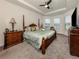 Spacious primary bedroom featuring a tray ceiling, large windows, and neutral decor at 5853 Semolino St, Nokomis, FL 34275