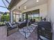 The outdoor patio offers comfortable seating, a fire pit, and a grill for enjoyable outdoor living at 5853 Semolino St, Nokomis, FL 34275
