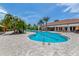 Inviting community pool showcasing lush landscaping, lounge seating, and a well-maintained pool deck at 5853 Semolino St, Nokomis, FL 34275