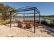 Relaxing lakeside seating area with comfortable chairs, ideal for enjoying the views at 5853 Semolino St, Nokomis, FL 34275