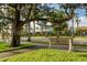 Charming street view featuring benches, lush greenery, and building with shops in a beautiful setting at 5853 Semolino St, Nokomis, FL 34275