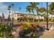 Charming street with floral planters and beautiful architecture, creating a welcoming atmosphere for pedestrians at 5853 Semolino St, Nokomis, FL 34275