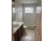 Bright bathroom with a shower-tub combo, toilet, and vanity with storage at 5966 Willows Bridge Loop, Ellenton, FL 34222