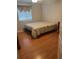 A bedroom with a bed and a window with valance offering privacy and natural light at 5966 Willows Bridge Loop, Ellenton, FL 34222