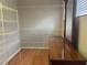 Spacious walk-in closet with wood floors and custom adjustable shelving at 5966 Willows Bridge Loop, Ellenton, FL 34222