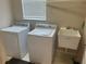 Laundry room featuring modern appliances and a utility sink at 5966 Willows Bridge Loop, Ellenton, FL 34222