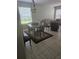 Neutral living and dining area with tile floors and lots of natural light at 5966 Willows Bridge Loop, Ellenton, FL 34222