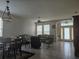 Bright living room with tile floors, ceiling fan, and front door with leaded glass at 5966 Willows Bridge Loop, Ellenton, FL 34222