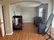An open space with wood floors and a treadmill, mirror, desk, and other items at 5966 Willows Bridge Loop, Ellenton, FL 34222