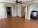 An open space featuring hard wood floors and doorways that lead to other rooms at 5966 Willows Bridge Loop, Ellenton, FL 34222