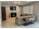 Cozy living room with comfortable seating, a ceiling fan, and a wall-mounted TV at 5966 Willows Bridge Loop, Ellenton, FL 34222