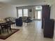 Inviting living room with tile flooring, neutral walls, and plenty of natural light at 5966 Willows Bridge Loop, Ellenton, FL 34222