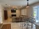 Spacious living area with a comfortable sofa and connected dining space at 5966 Willows Bridge Loop, Ellenton, FL 34222