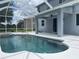 View of backyard pool featuring a jacuzzi tub, white deck, and screened-in enclosure at 5966 Willows Bridge Loop, Ellenton, FL 34222