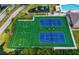 Aerial view of recreational facilities including basketball and tennis courts, plus a playground at 5966 Willows Bridge Loop, Ellenton, FL 34222