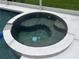 Inviting in-ground spa with tile surround and clear water at 5966 Willows Bridge Loop, Ellenton, FL 34222