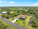 Aerial view showcases the house and a vast landscape of trees and lush greenery at 6199 Stamp St, Port Charlotte, FL 33981