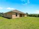 The home has a large backyard and covered patio, perfect for relaxation and entertaining at 6199 Stamp St, Port Charlotte, FL 33981