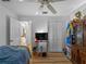 Bright bedroom with light hardwood floors and access to closet space at 6199 Stamp St, Port Charlotte, FL 33981