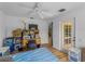 Bedroom featuring light hardwood floors, door to outside, and large desk at 6199 Stamp St, Port Charlotte, FL 33981