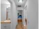Hallway with views into a bedroom, a bathroom, and a living space at 6199 Stamp St, Port Charlotte, FL 33981