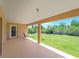 Spacious covered patio overlooking a lush green yard is perfect for outdoor living at 6199 Stamp St, Port Charlotte, FL 33981