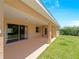 Large covered patio overlooking expansive backyard offers privacy and outdoor living space at 6199 Stamp St, Port Charlotte, FL 33981