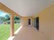 A covered patio offers a tranquil space for outdoor relaxation and entertainment at 6199 Stamp St, Port Charlotte, FL 33981