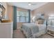 Cozy bedroom with calming decor, plush bedding, and ample natural light at 629 Ibiza Loop, Venice, FL 34292