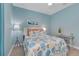 Airy bedroom features coastal-themed décor, soft lighting, and a modern aesthetic at 629 Ibiza Loop, Venice, FL 34292