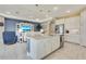 Open concept kitchen with an island, and seamlessly connects to the living room for easy socializing at 629 Ibiza Loop, Venice, FL 34292