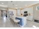 Bright kitchen with a center island, modern appliances, and breakfast bar seating at 629 Ibiza Loop, Venice, FL 34292