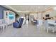 Open-concept living and kitchen area with modern furnishings and ample natural light at 629 Ibiza Loop, Venice, FL 34292