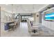 Open-concept living space featuring an eat-in kitchen, stylish furniture, and ample natural light at 629 Ibiza Loop, Venice, FL 34292