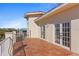 Balcony with tile floor, white railings and pillars, and beautiful views from the French doors at 63 Palm Dr, Placida, FL 33946