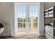 The balcony doors offer a view and natural light to this bedroom at 63 Palm Dr, Placida, FL 33946