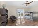 A well-lit bedroom offers a bunk bed, wood-look floors, and a balcony at 63 Palm Dr, Placida, FL 33946