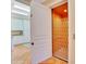 Interior view of elevator with lattice door plus laundry area with ample storage and counter space at 63 Palm Dr, Placida, FL 33946