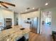 Well-equipped kitchen boasting granite countertops, stainless steel appliances, and ample cabinet space for culinary enthusiasts at 63 Palm Dr, Placida, FL 33946