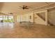 Large covered patio featuring an entertainment area, ping pong table, and easy access to the backyard at 63 Palm Dr, Placida, FL 33946
