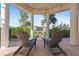 Charming outdoor seating area with beautiful waterfront views on travertine tile at 63 Palm Dr, Placida, FL 33946