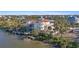 Waterfront property showing dock and waterway access, with Spanish style home and dock at 63 Palm Dr, Placida, FL 33946