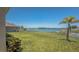 Expansive backyard with lush green lawn and waterfront views, perfect for outdoor activities and relaxation at 632 Tanana Fall Dr, Ruskin, FL 33570